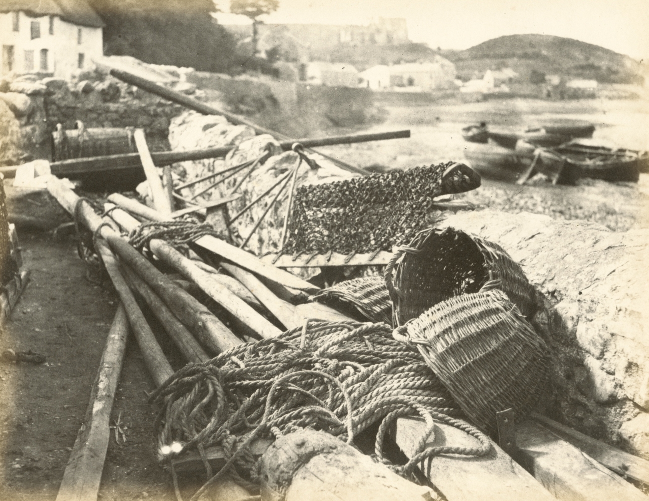Hugh OWEN (English, 1808-1897) Dredges and baskets at Oystermouth, The Gower Albumen print, 1860s-1870s, from a paper negative, before 1855 17.3 x 22.4 cm mounted on 26.0 x 28.3 cm album sheet Numbered "71" in pencil on mount