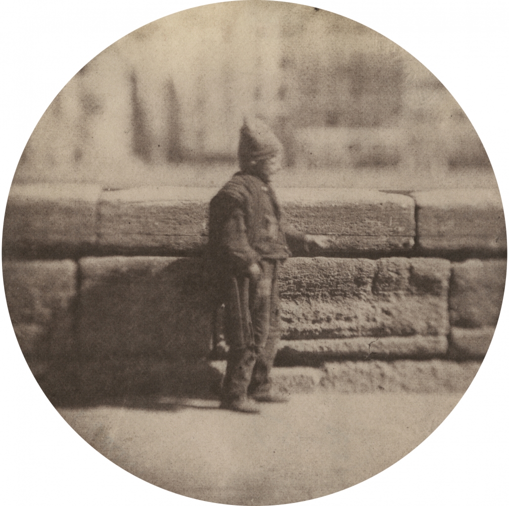 Charles NÈGRE (French, 1820-1880) Le petit ramoneur, December 1851 Salt print from a waxed paper negative with selectively applied graphite 8.7 cm tondo Blindstamp "Canson"
